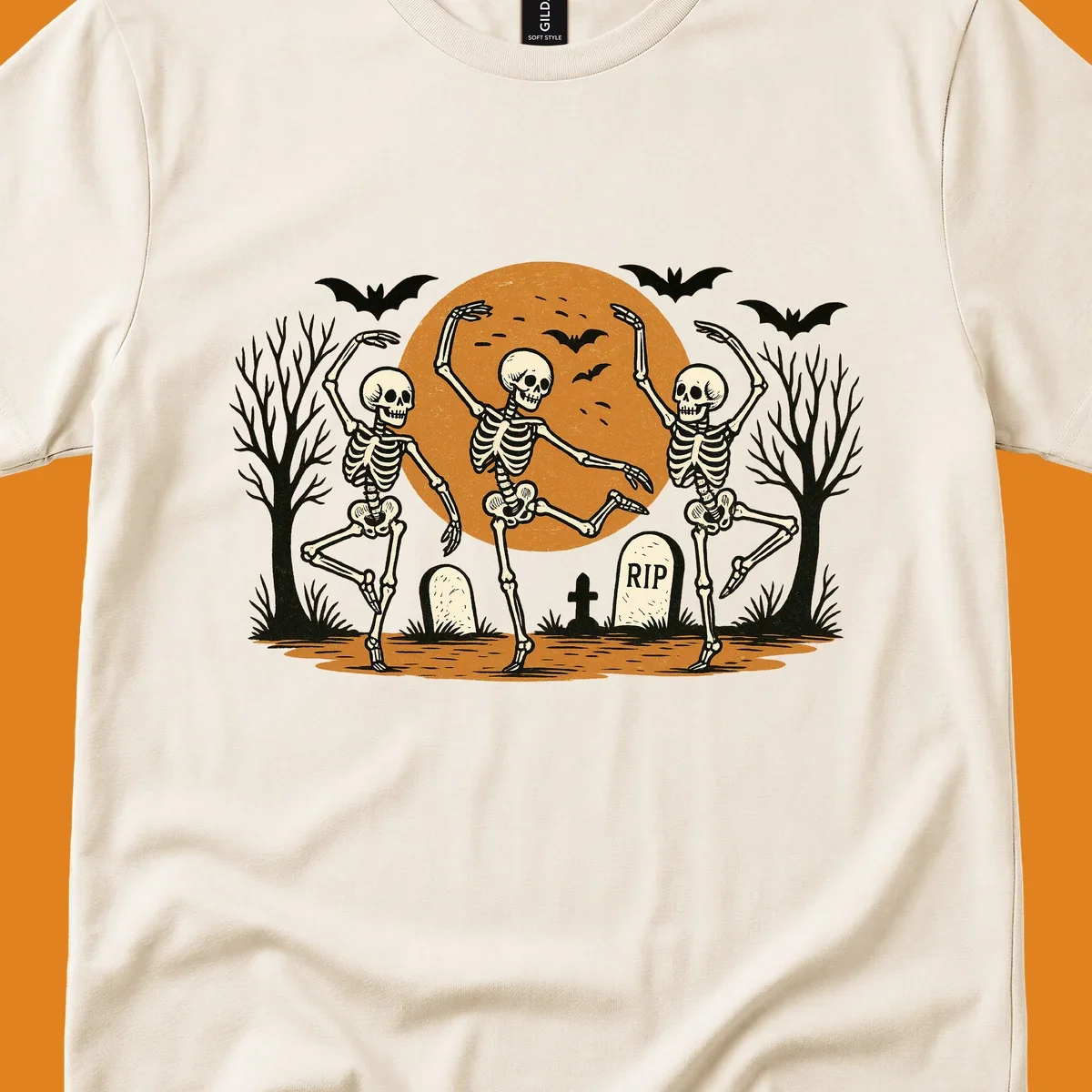 Dancing skeletons Halloween design with a full moon, bats, and gravestones.