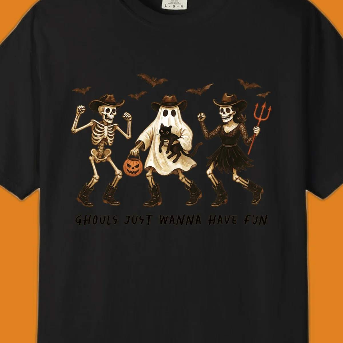 Halloween cowboy skeletons and ghost dancing with a cat and pumpkin, text reads Ghouls Just Wanna Have Fun.