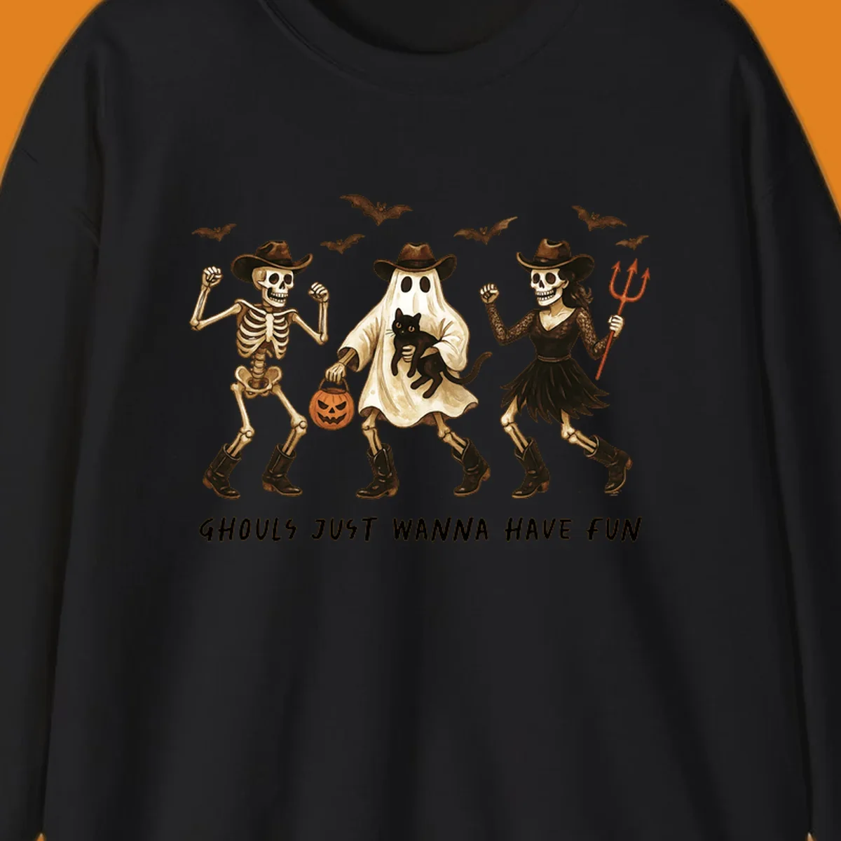 Halloween cowboy skeletons and ghost dancing with a cat and pumpkin, text reads Ghouls Just Wanna Have Fun.