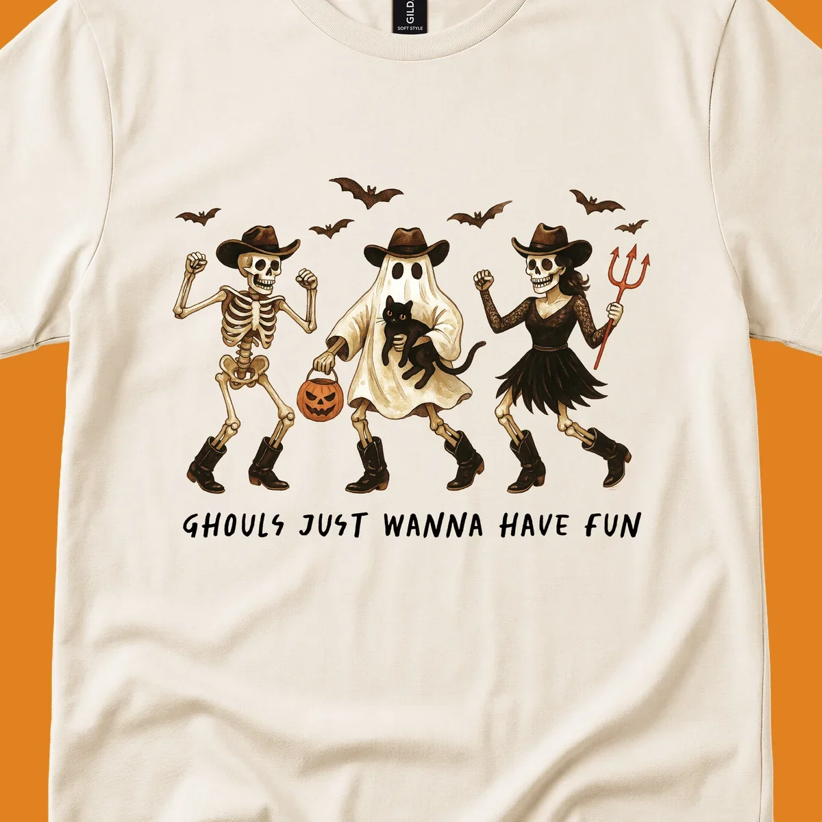 Halloween cowboy skeletons and ghost dancing with a cat and pumpkin, text reads Ghouls Just Wanna Have Fun.