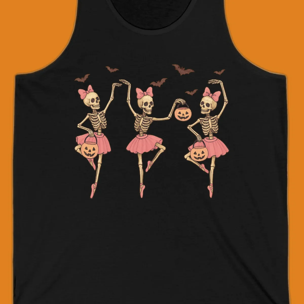 Skeleton ballerinas in tutus with pumpkins and bats, perfect for Halloween.
