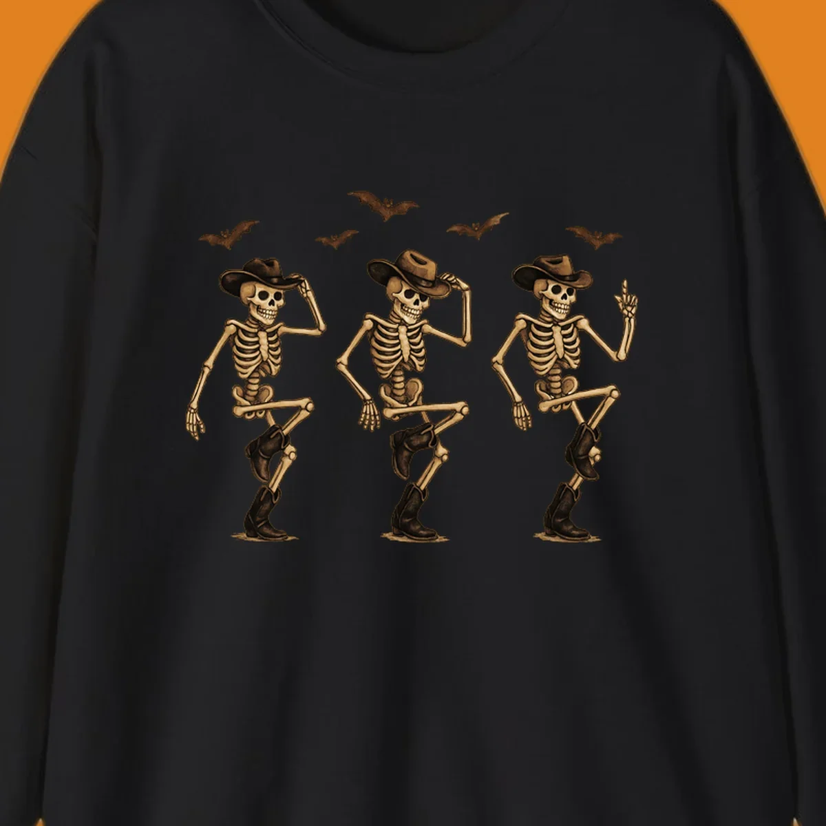 Dancing cowboy skeletons with bats, vintage Halloween graphic.