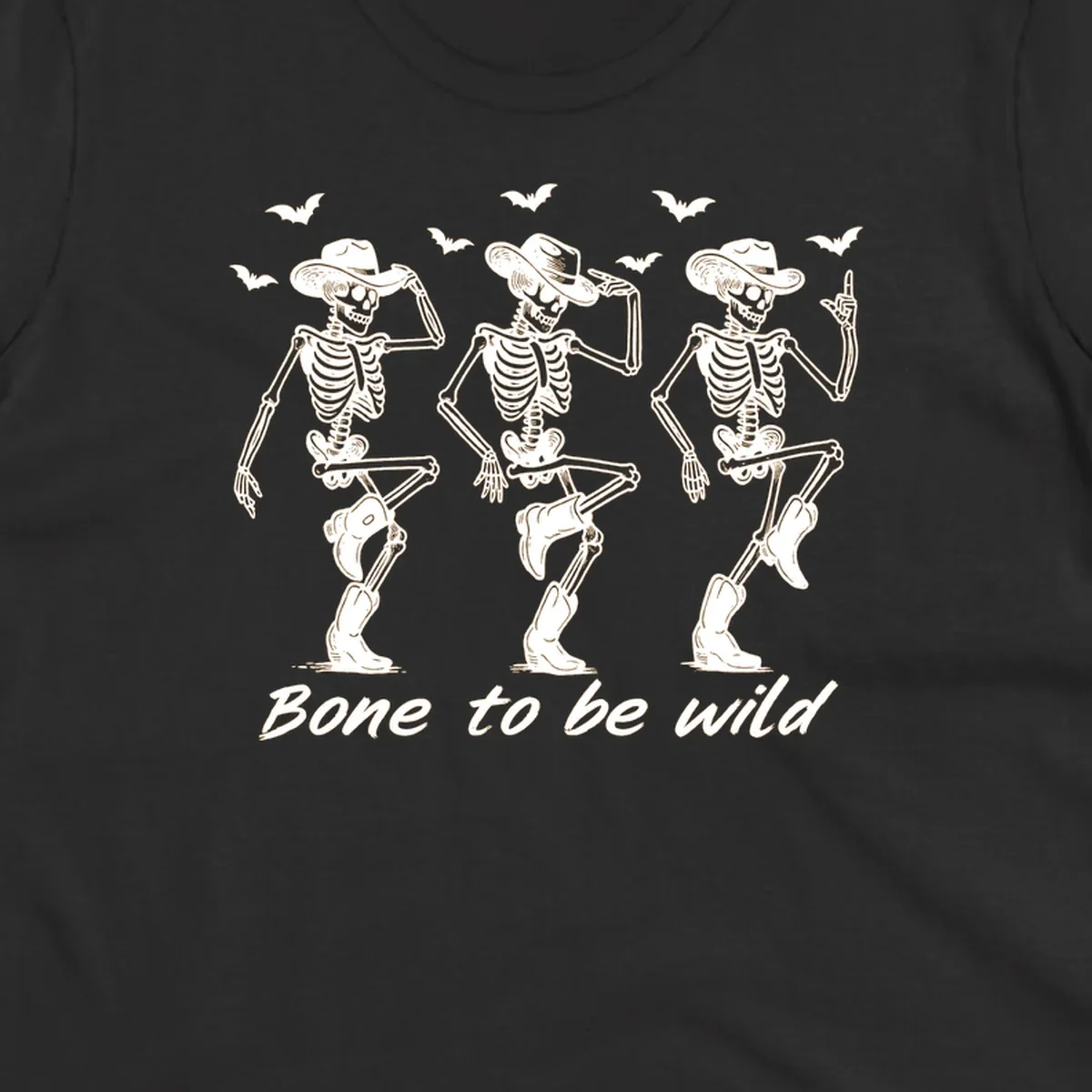 Three dancing skeletons in cowboy hats and boots with bats and the phrase 'Bone to be wild', bone-to-be-wild-cowboy