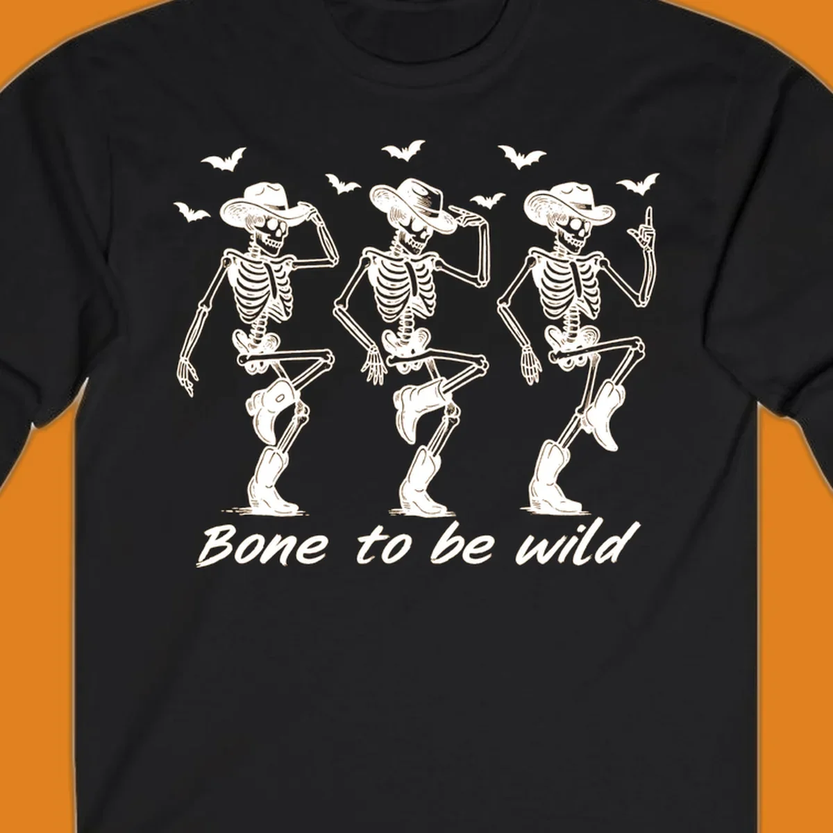 Three dancing skeletons in cowboy hats and boots with bats and the phrase 'Bone to be wild', bone-to-be-wild-cowboy