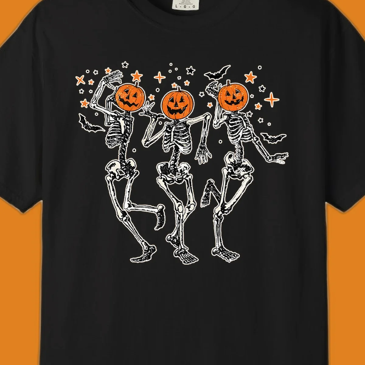 Dancing skeletons with pumpkin heads, bats, and stars illustration for Halloween.