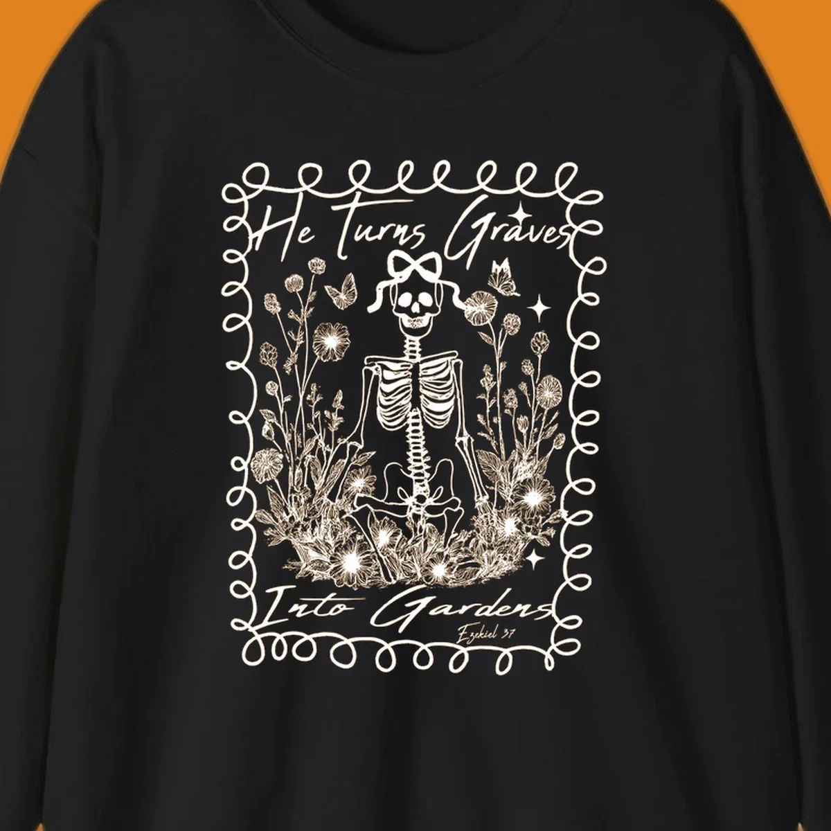 Skeleton surrounded by flowers and butterflies, text reads 'He Turns Graves Into Gardens', graves-into-gardens concept.