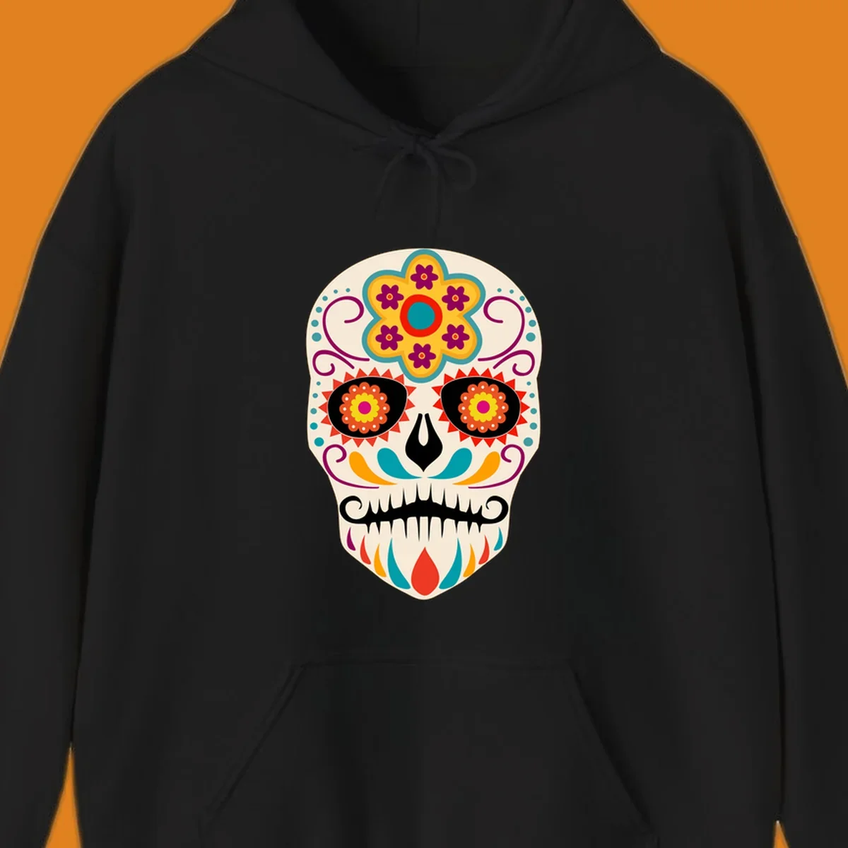 A vibrant sugar skull calavera illustration with a yellow and teal floral crown, swirls, and colorful patterns around its eyes.