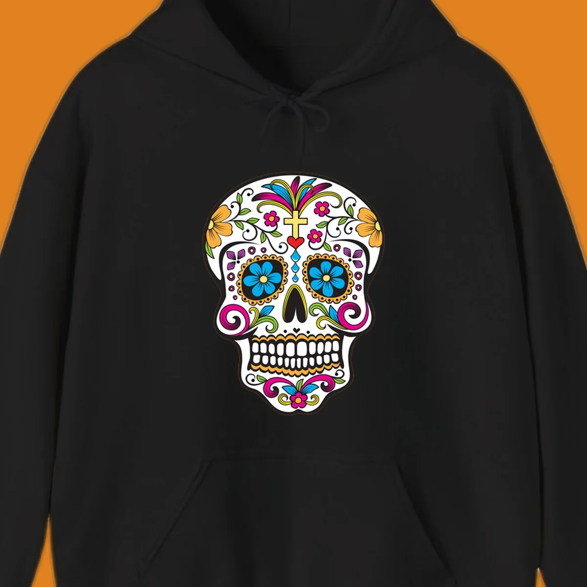 A vibrant sugar skull calavera illustration with colorful flowers, green leaves, a golden cross, and blue tears.