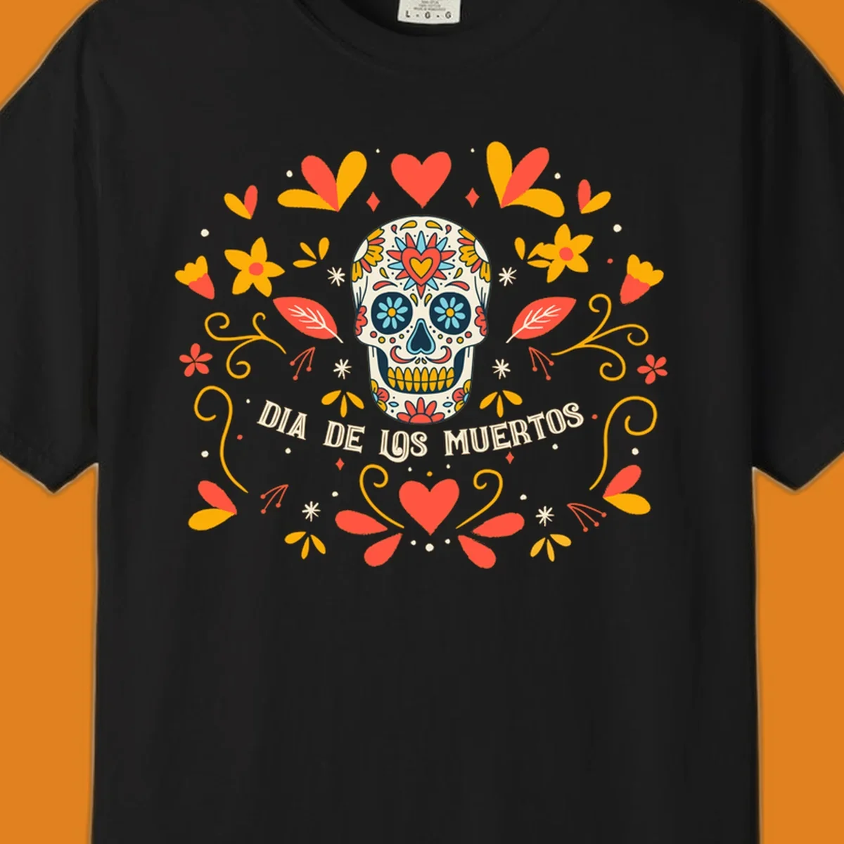 A colorful Día de los Muertos sugar skull with a heart on its forehead, surrounded by a symmetrical frame of red hearts, yellow flowers, and leaves, with 'DIA DE LOS MUERTOS' text below.