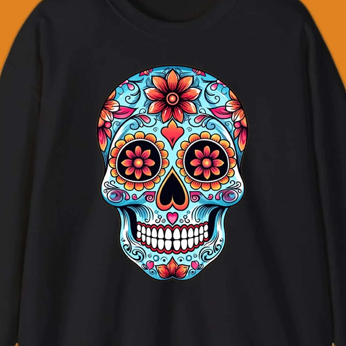 A vibrant blue floral-sugar-skull with orange, pink, and yellow flowers, black eyes, and white teeth.