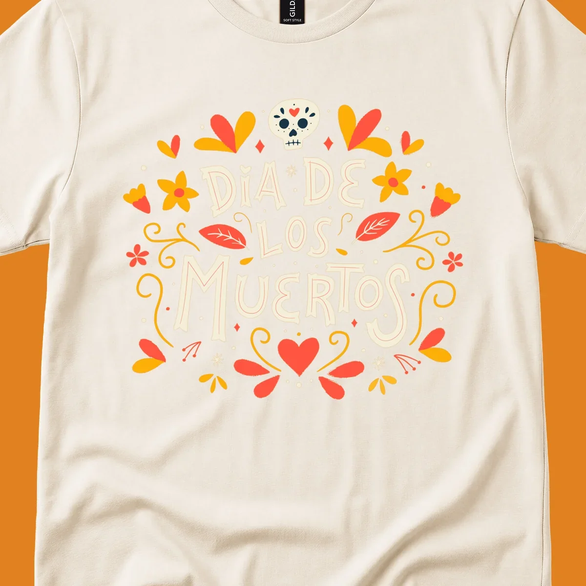 Decorative 'DIA DE LOS MUERTOS' text encircled by a vibrant dia-de-los-muertos-skull-wreath of flowers, leaves, and a sugar skull.