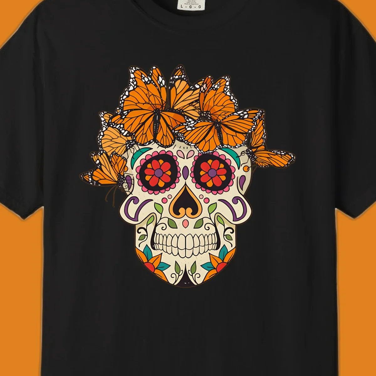 A cream sugar skull with colorful floral patterns and a crown of orange and black monarch butterflies.