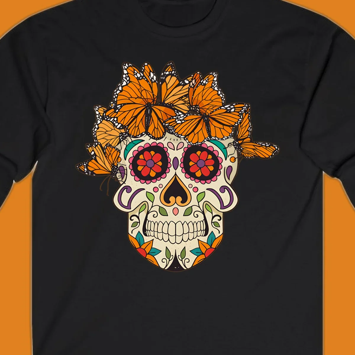 A cream sugar skull with colorful floral patterns and a crown of orange and black monarch butterflies.