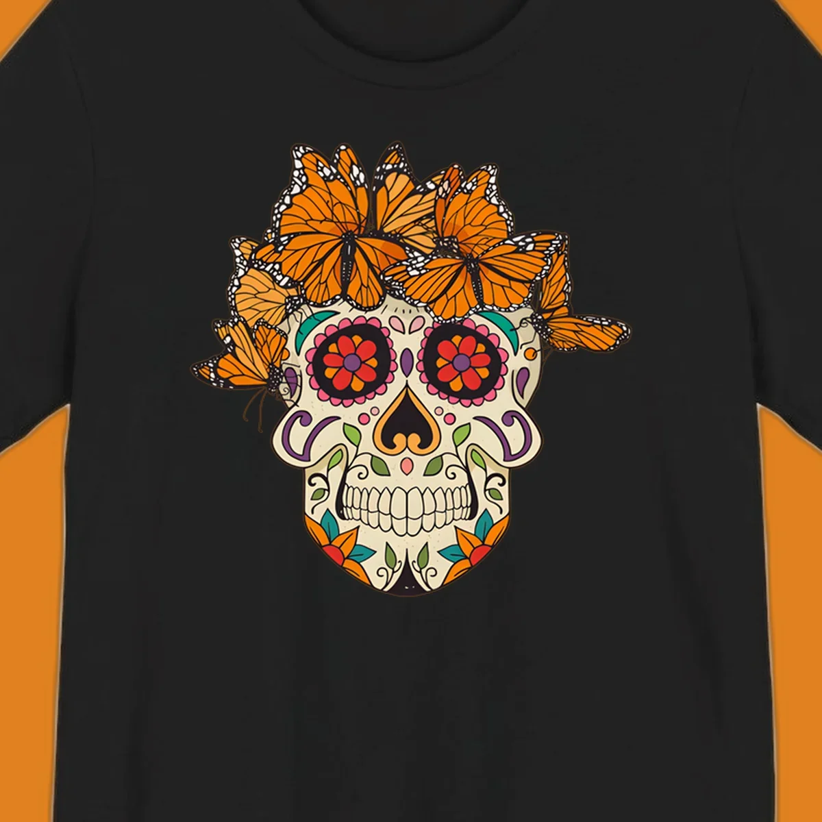 A cream sugar skull with colorful floral patterns and a crown of orange and black monarch butterflies.