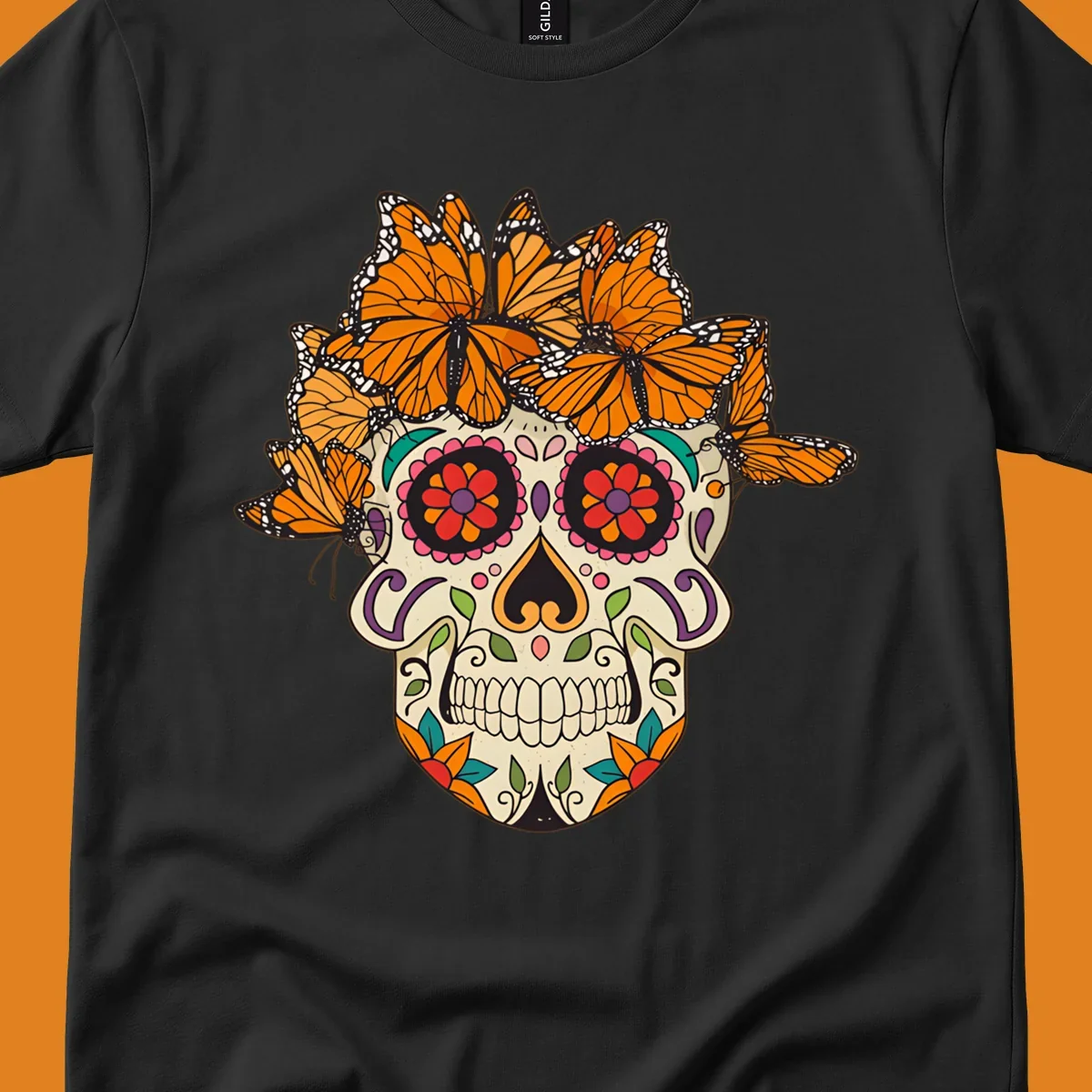 A cream sugar skull with colorful floral patterns and a crown of orange and black monarch butterflies.