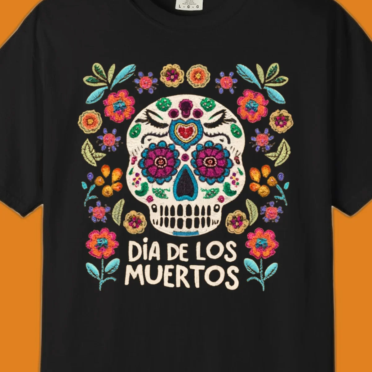 Embroidered-style Día de los Muertos sugar skull with colorful flowers and leaves, and text 'DÍA DE LOS MUERTOS'.