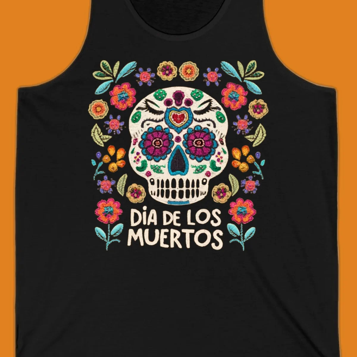 Embroidered-style Día de los Muertos sugar skull with colorful flowers and leaves, and text 'DÍA DE LOS MUERTOS'.