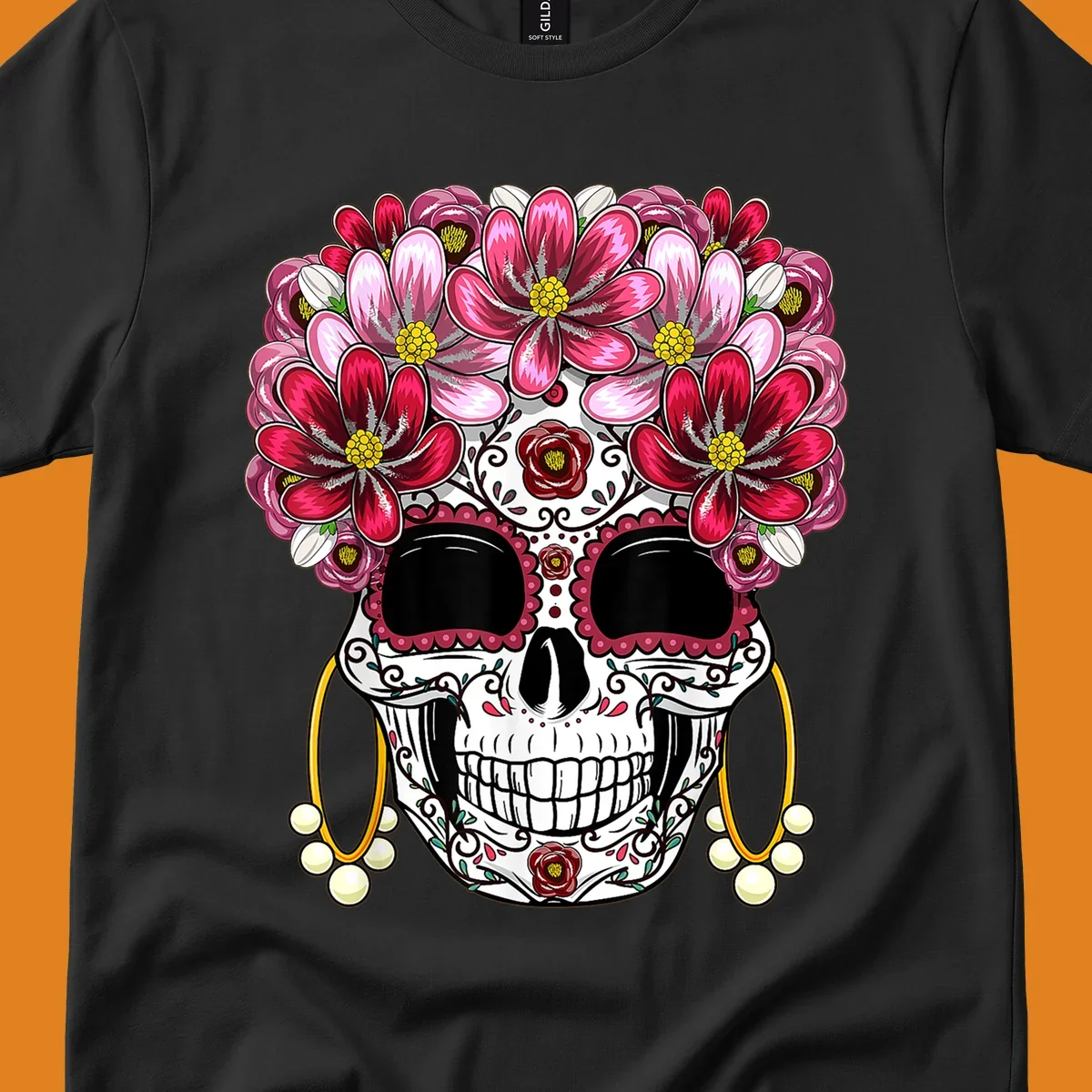 An ornate floral sugar skull with a crown of pink and red flowers, scrollwork, and pearl earrings on a black background.