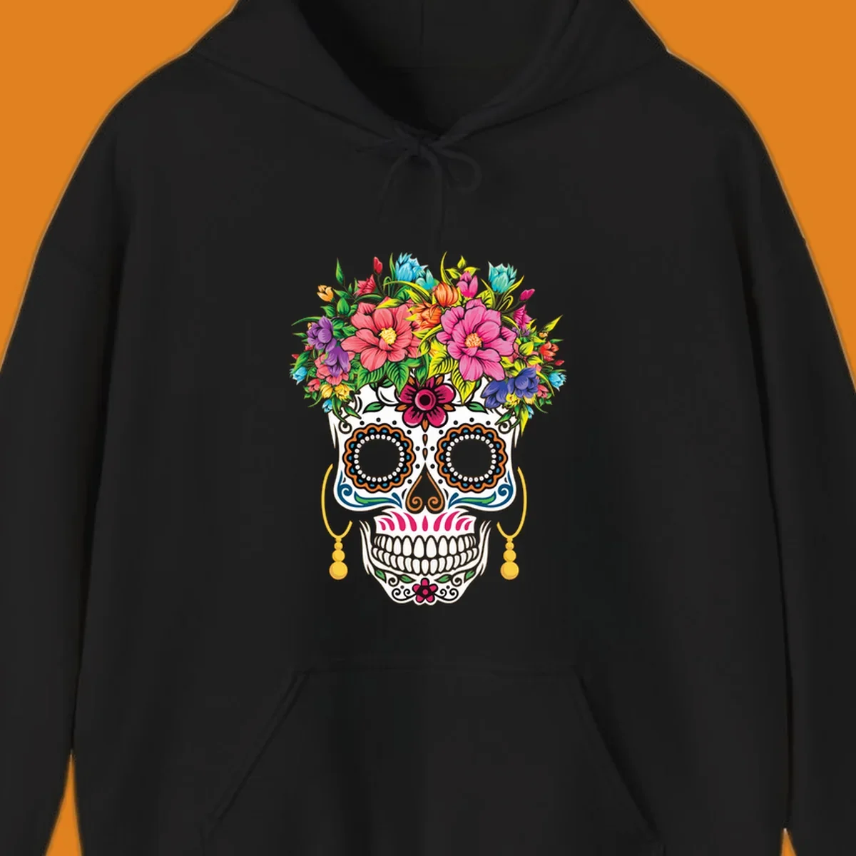 A vibrant floral calavera skull with a large, colorful flower crown and decorative patterns, featuring gold earrings.