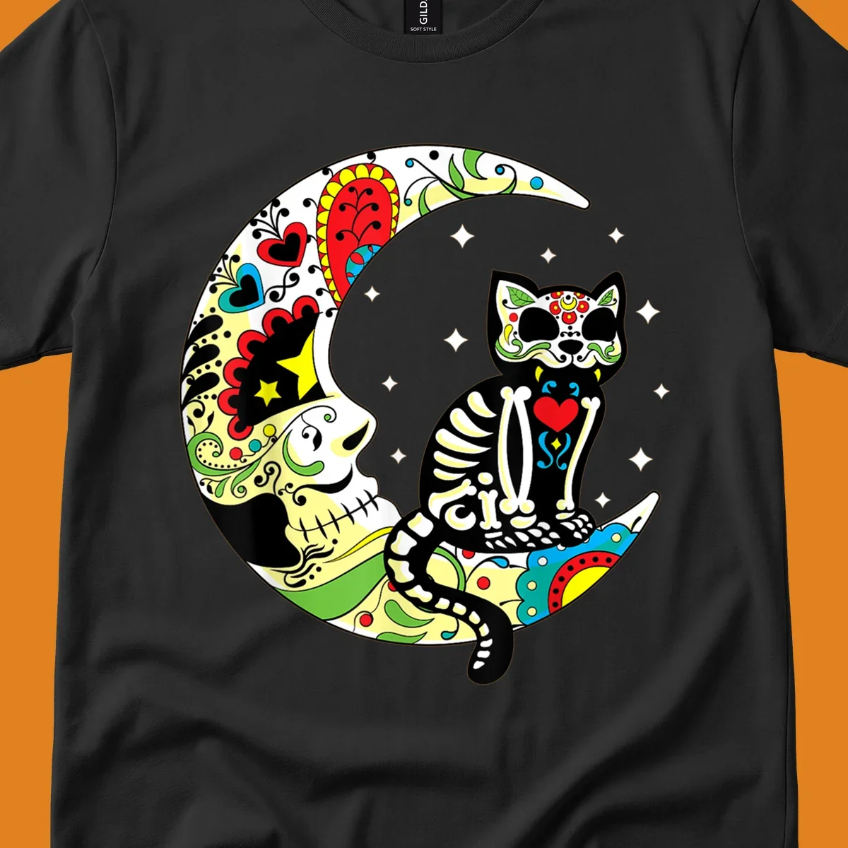 A colorful sugar skull cat with a skeleton body sits on a crescent moon decorated with skull and floral patterns. Features a sugar-skull-cat-moon.