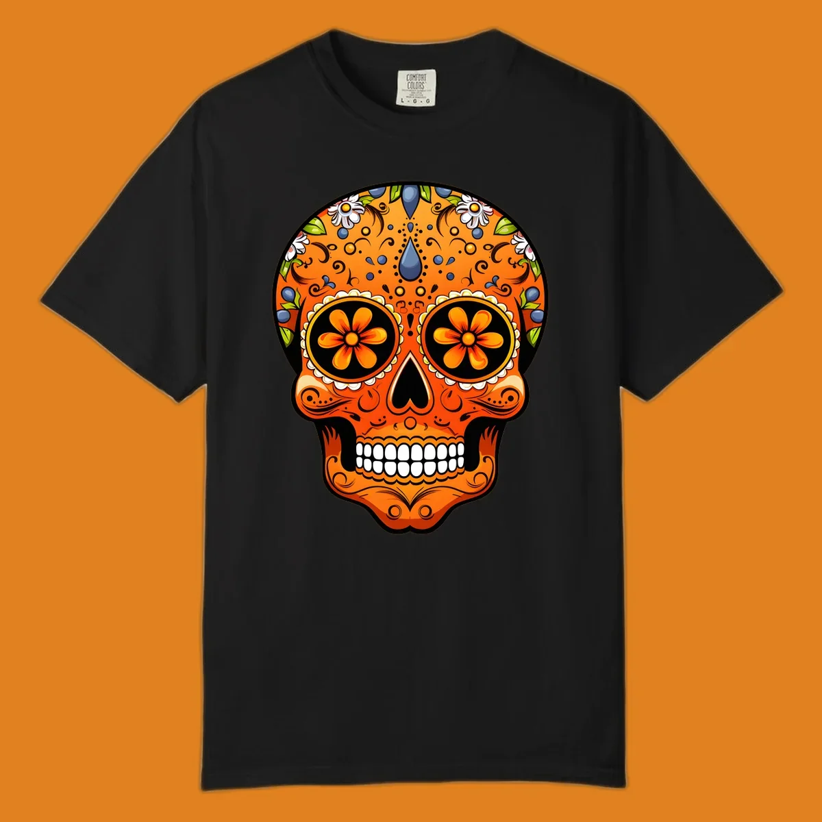 A vibrant orange calavera sugar skull with blue and white flowers, green leaves, and intricate swirling patterns.