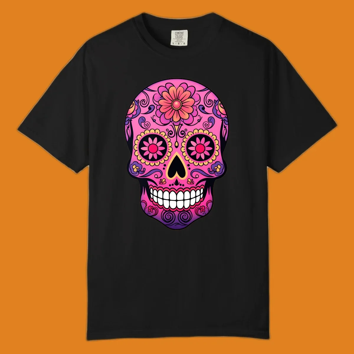 A vibrant pink, purple, yellow, and orange floral sugar skull with a heart nose and ornate swirls.