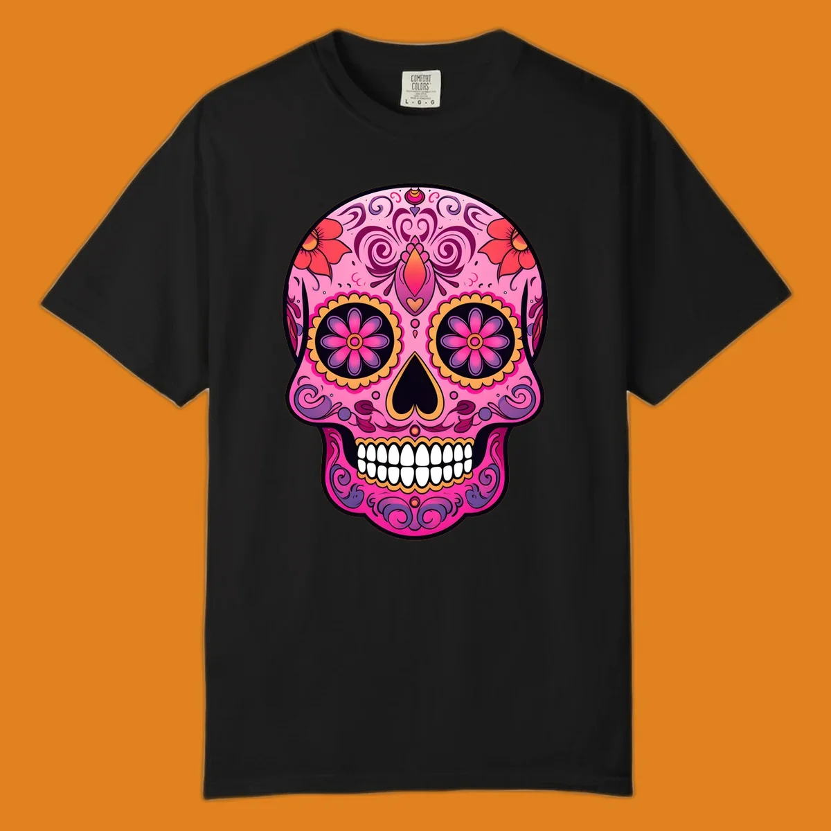 A vibrant pink and purple sugar skull, decorated with intricate floral patterns, swirls, and bright yellow and orange accents, featuring white teeth.