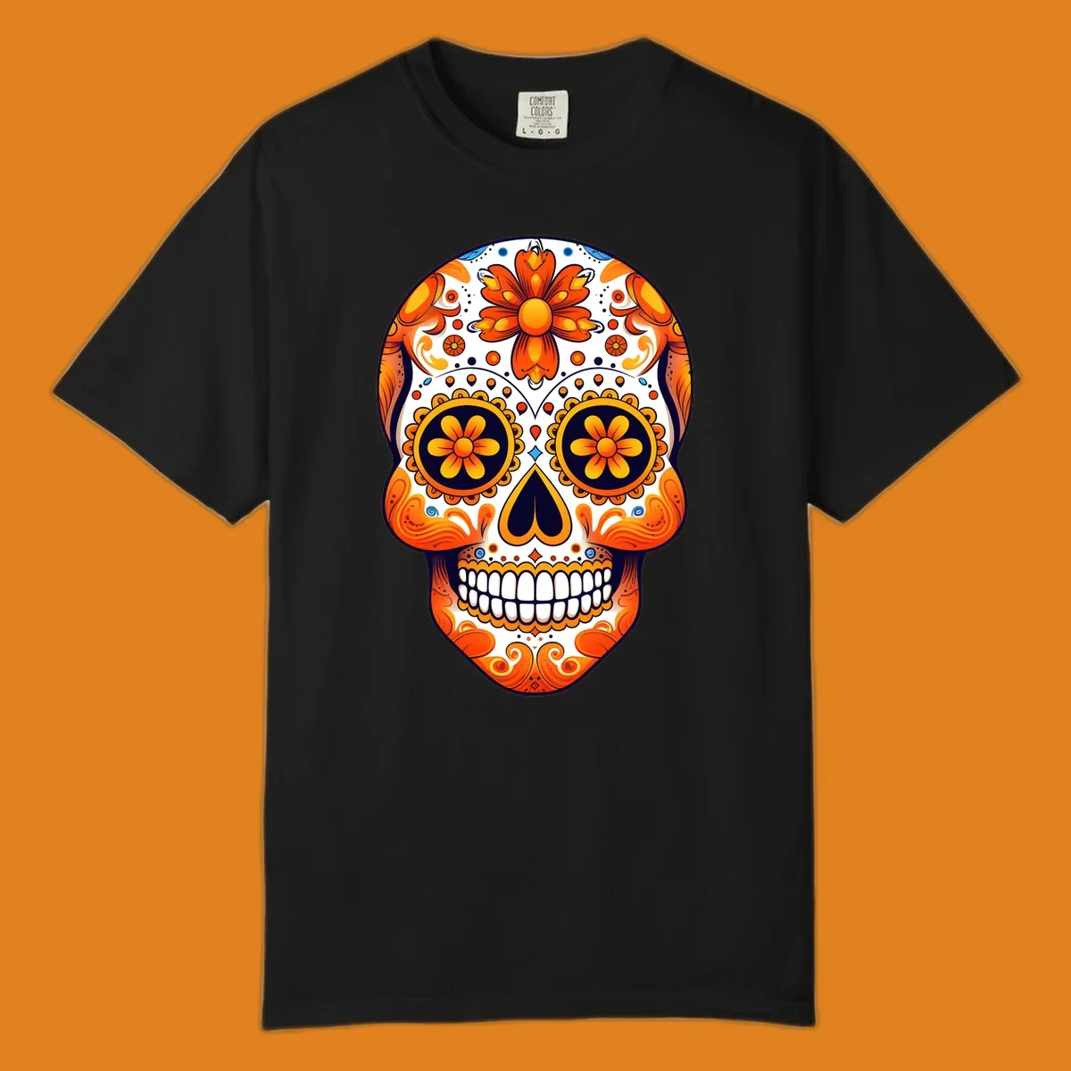 A vibrant marigold calavera skull illustration with orange flowers, white base, and navy accents.