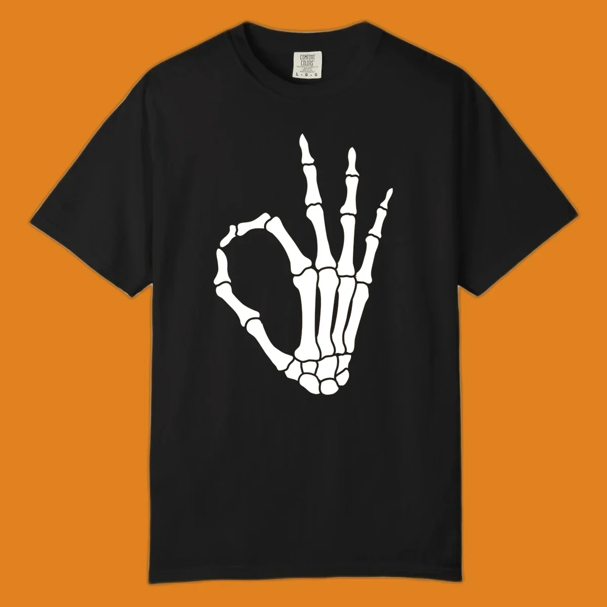 A white skeleton hand forms the 'okay' sign, with thumb and index finger creating a circle. A minimalist skeleton-hand-okay-sign.