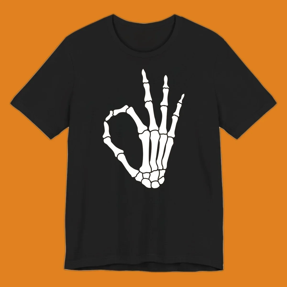 A white skeleton hand forms the 'okay' sign, with thumb and index finger creating a circle. A minimalist skeleton-hand-okay-sign.