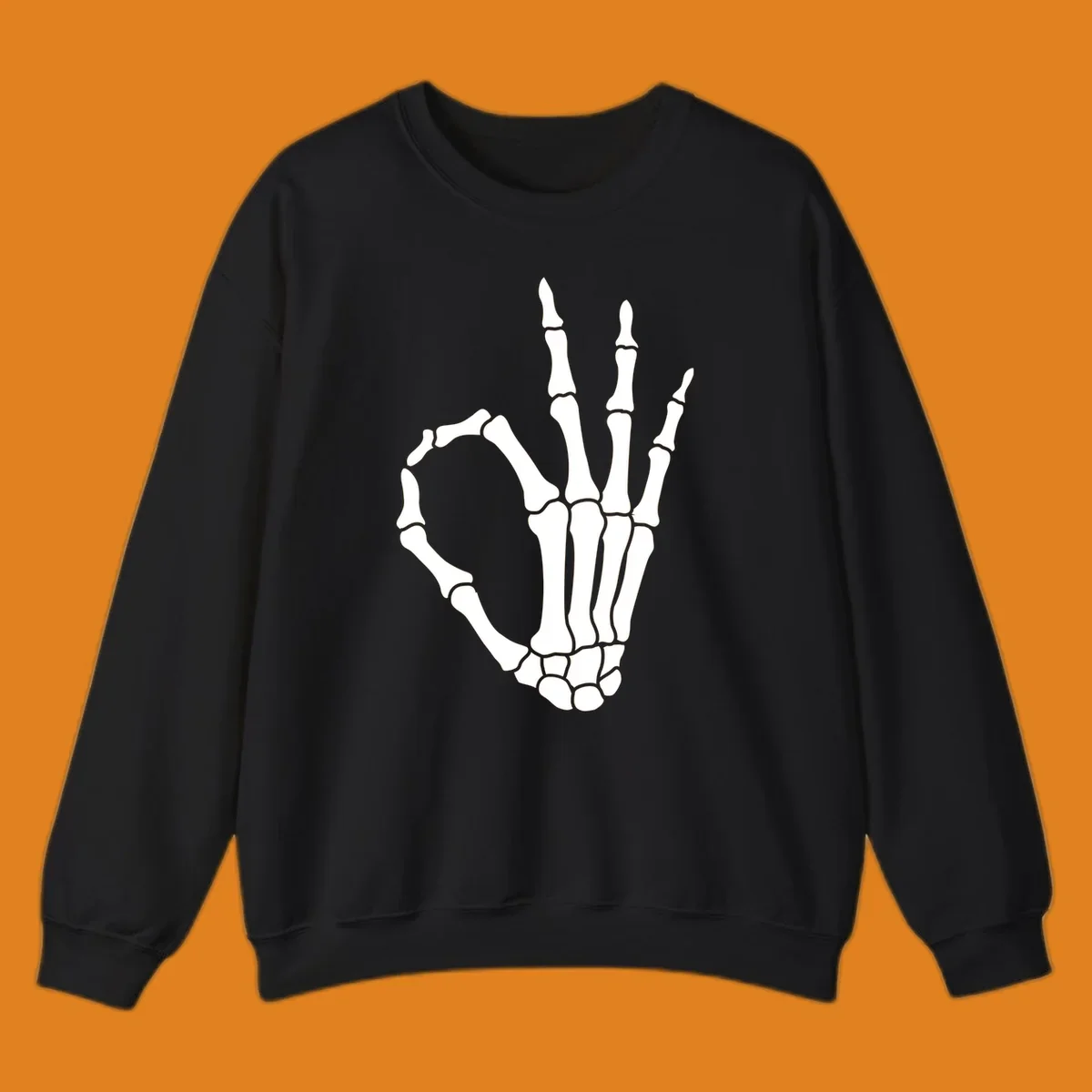 A white skeleton hand forms the 'okay' sign, with thumb and index finger creating a circle. A minimalist skeleton-hand-okay-sign.