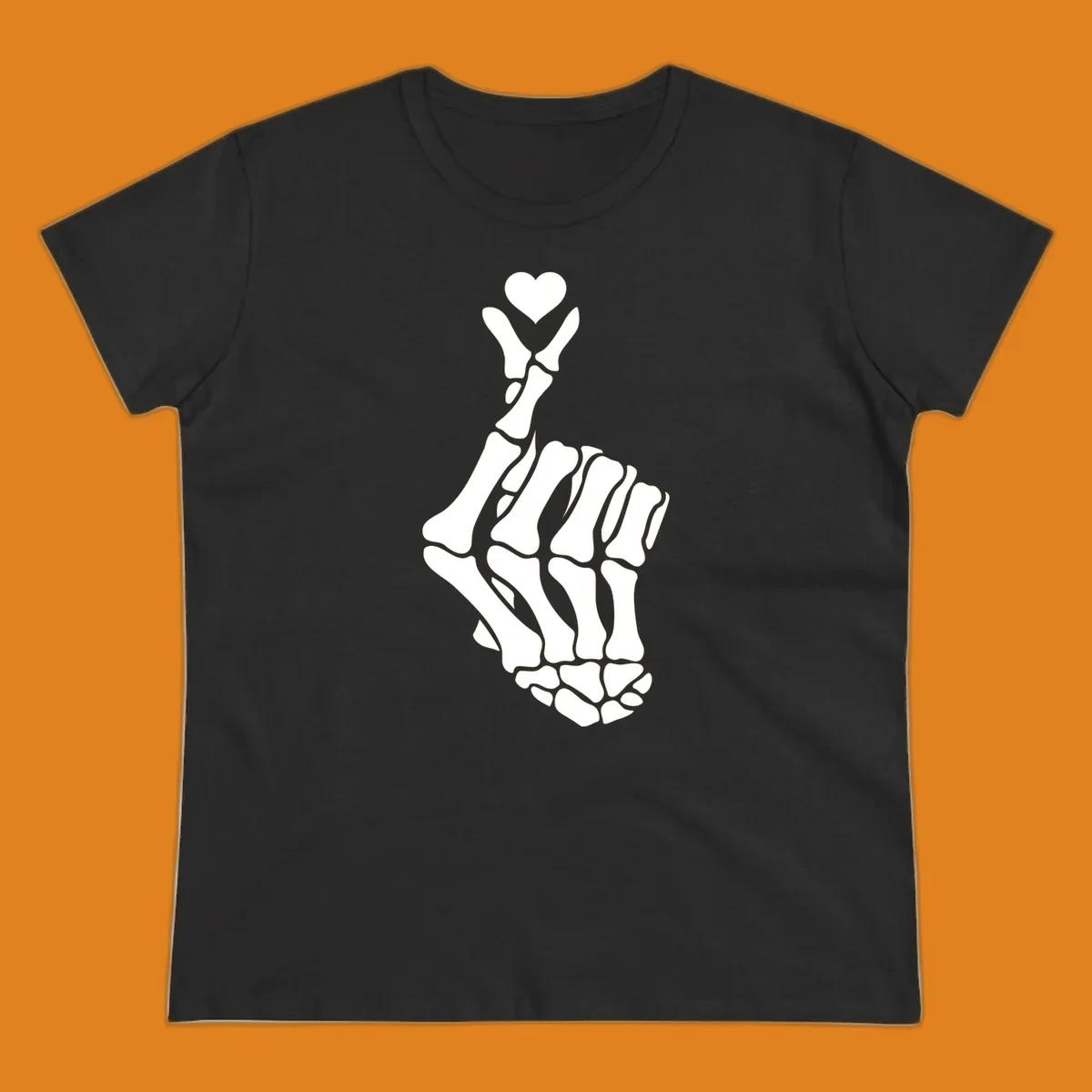 A white skeleton hand forms the Korean finger heart gesture, with a small heart shape at the fingertips. Concept: skeleton-finger-heart.