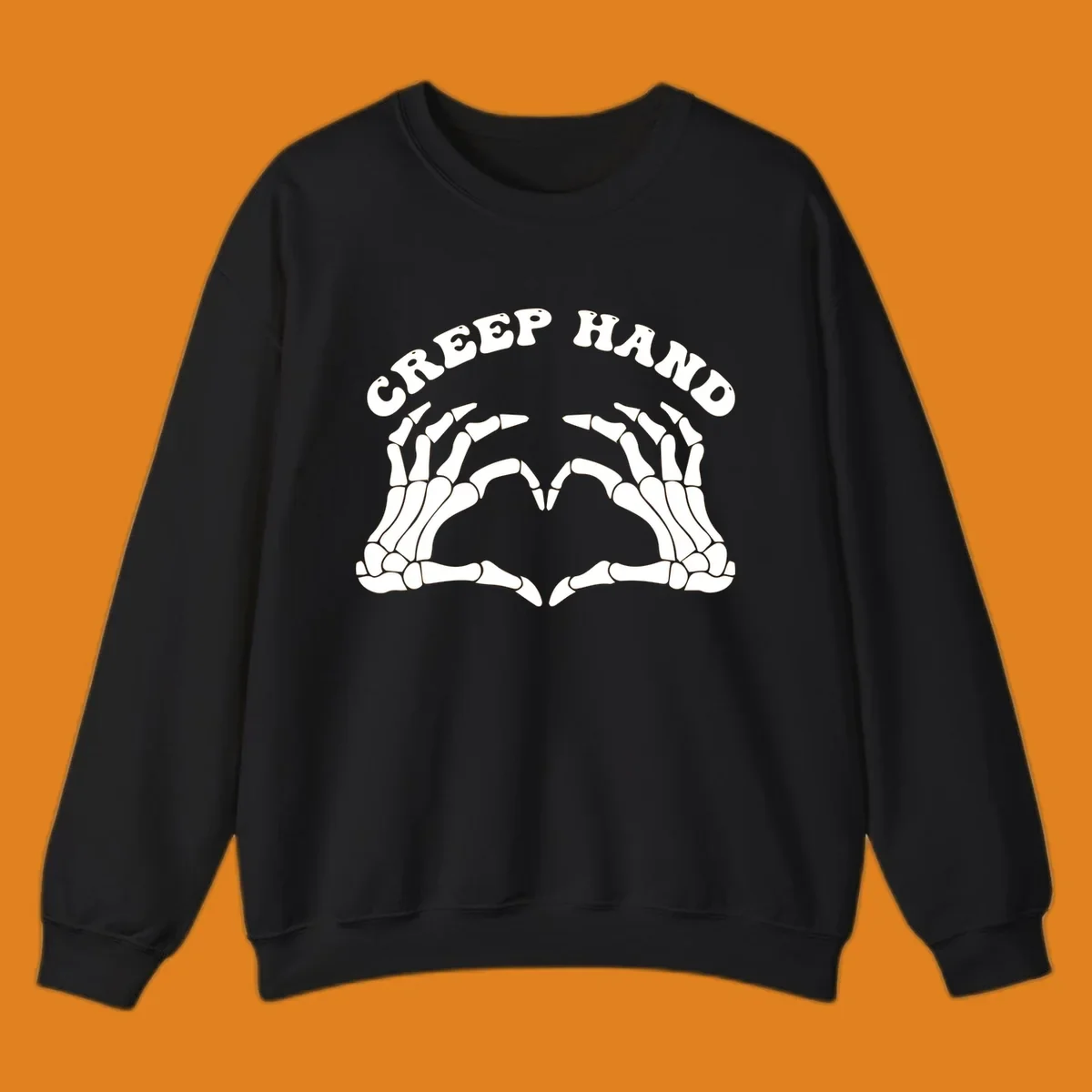 A white creep-hand-skeleton-heart design with two skeleton hands forming a heart shape below the arched text 'CREEP HAND'.