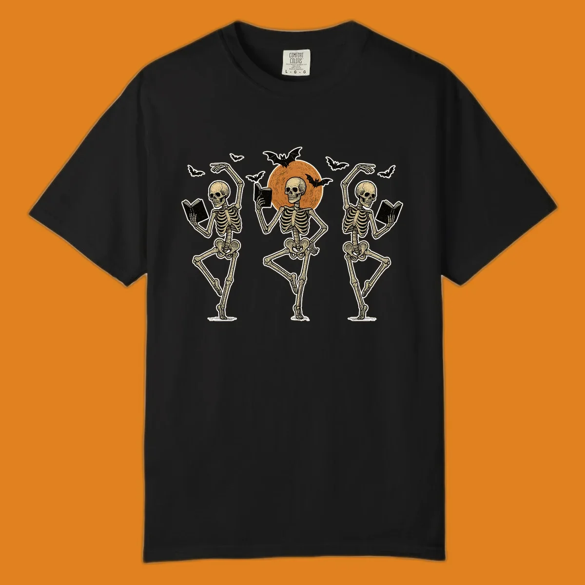 Dancing skeletons reading books under a moon with bats, skeleton-book-dance design.