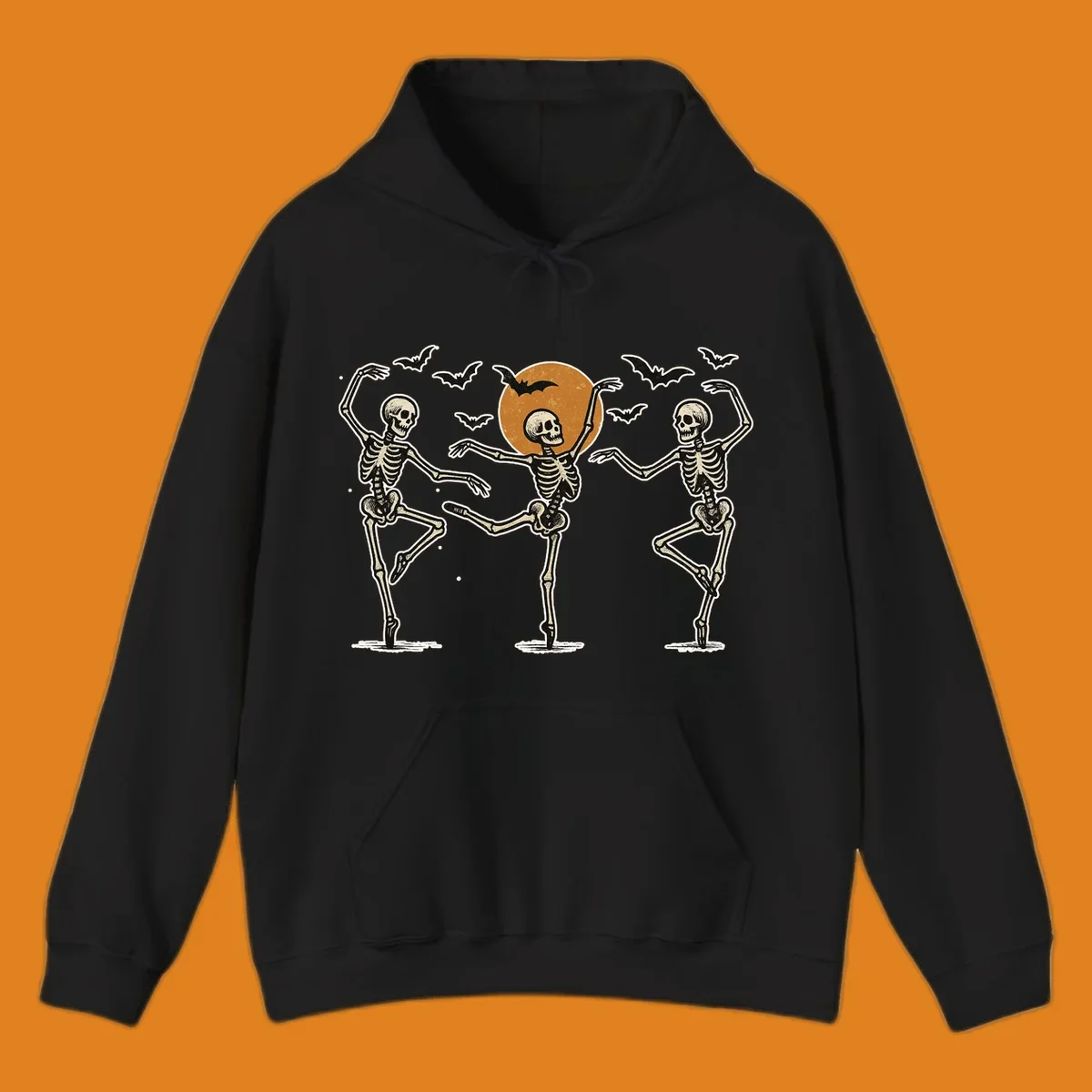 Vintage illustration of three dancing skeletons under a Halloween moon with bats, evoking a spooky ballet.