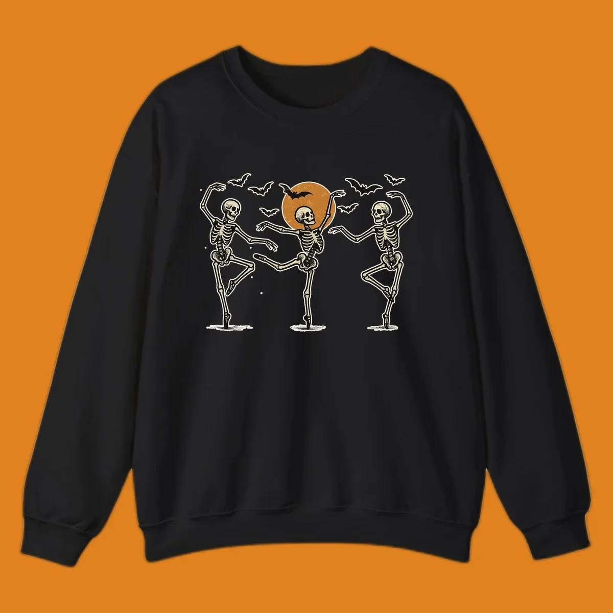 Vintage illustration of three dancing skeletons under a Halloween moon with bats, evoking a spooky ballet.