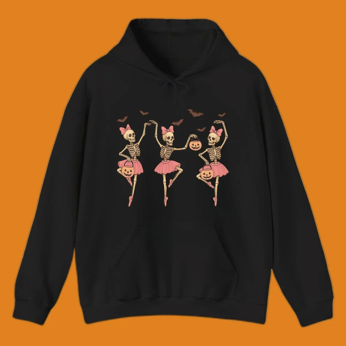 Skeleton ballerinas in tutus with pumpkins and bats, perfect for Halloween.