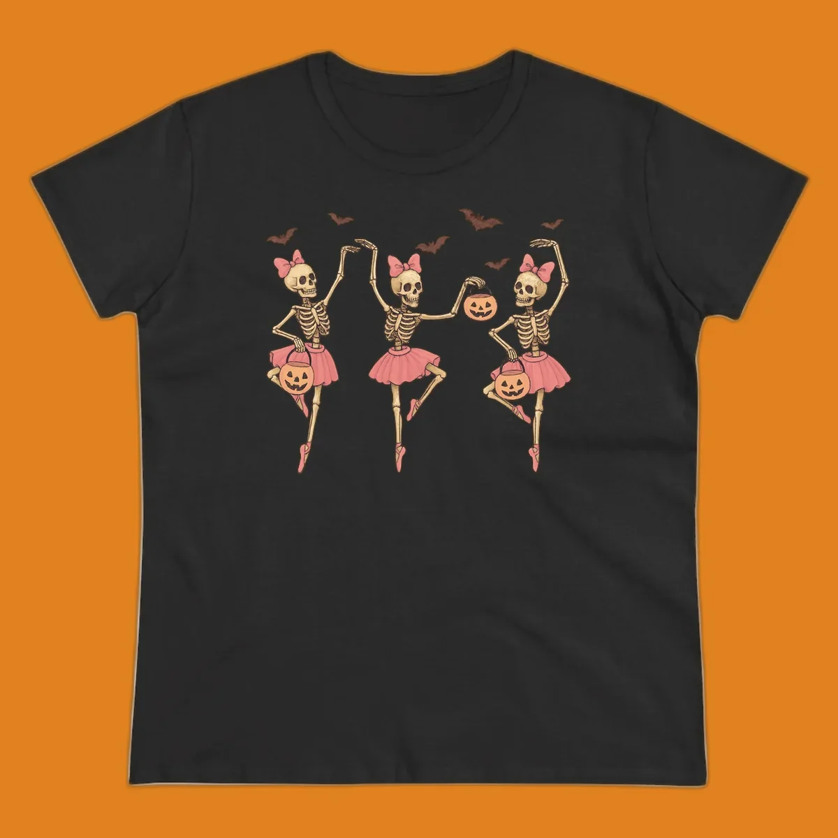 Skeleton ballerinas in tutus with pumpkins and bats, perfect for Halloween.