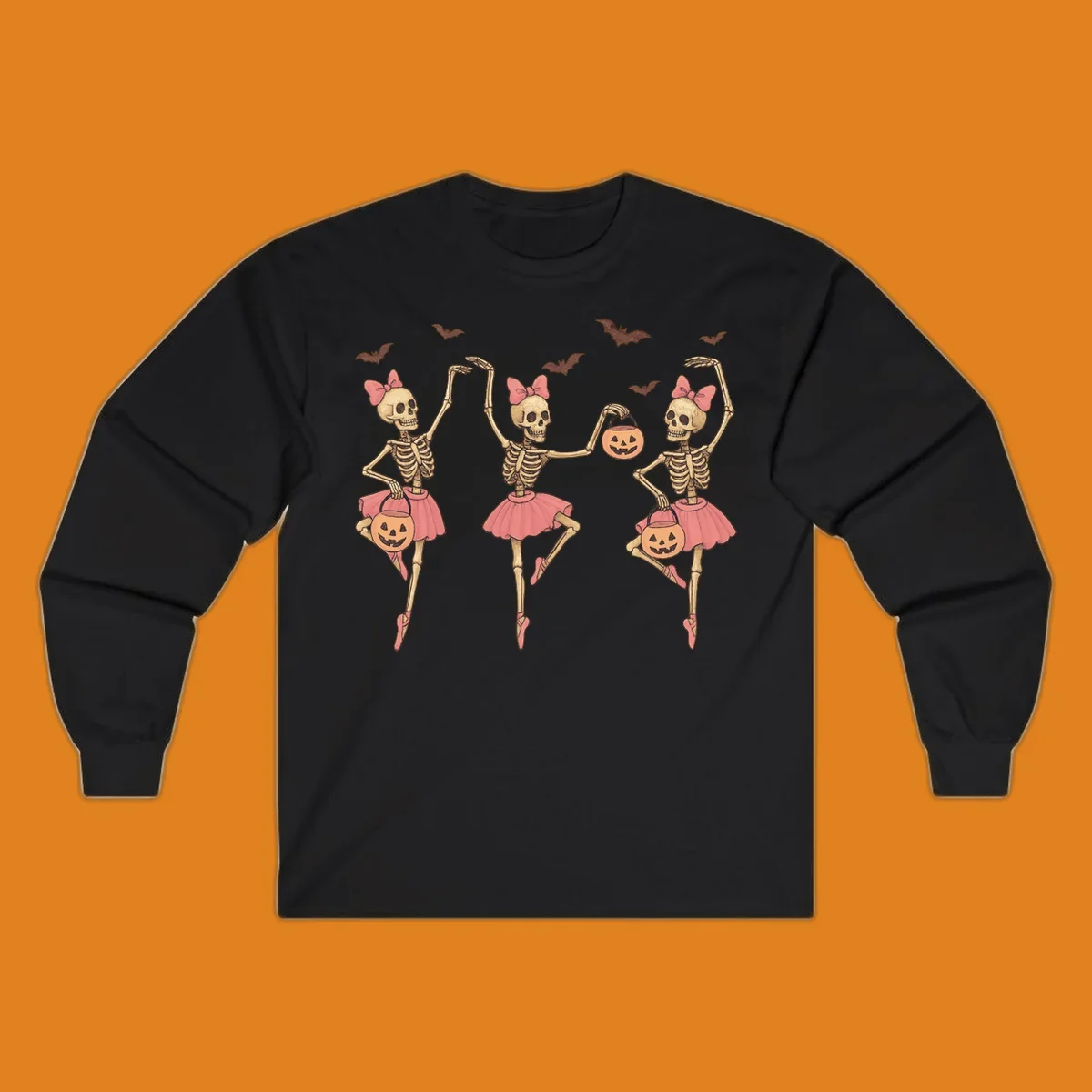Skeleton ballerinas in tutus with pumpkins and bats, perfect for Halloween.