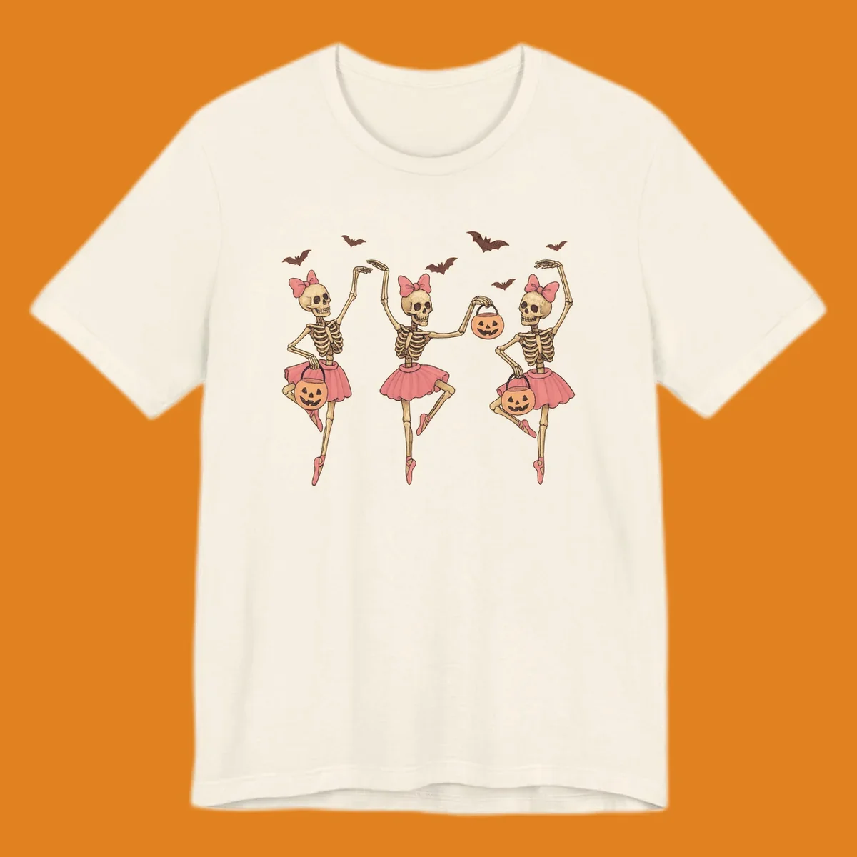 Skeleton ballerinas in tutus with pumpkins and bats, perfect for Halloween.