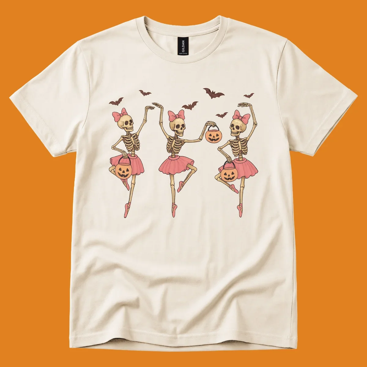 Skeleton ballerinas in tutus with pumpkins and bats, perfect for Halloween.