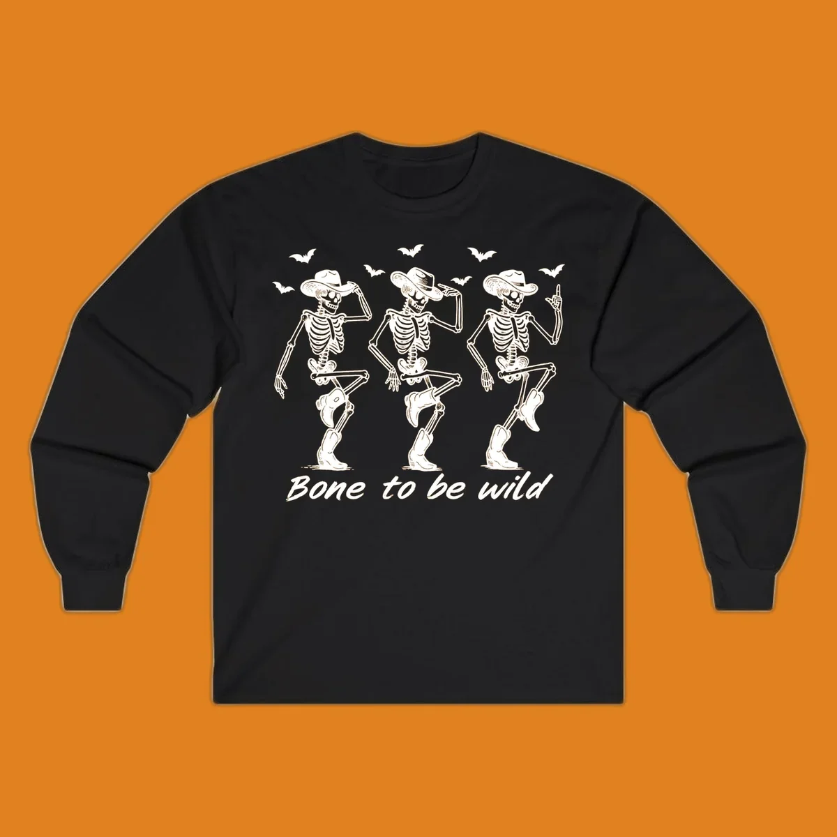 Three dancing skeletons in cowboy hats and boots with bats and the phrase 'Bone to be wild', bone-to-be-wild-cowboy