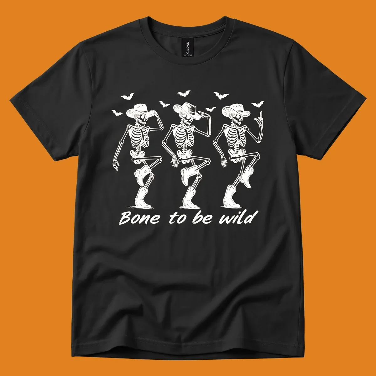 Three dancing skeletons in cowboy hats and boots with bats and the phrase 'Bone to be wild', bone-to-be-wild-cowboy