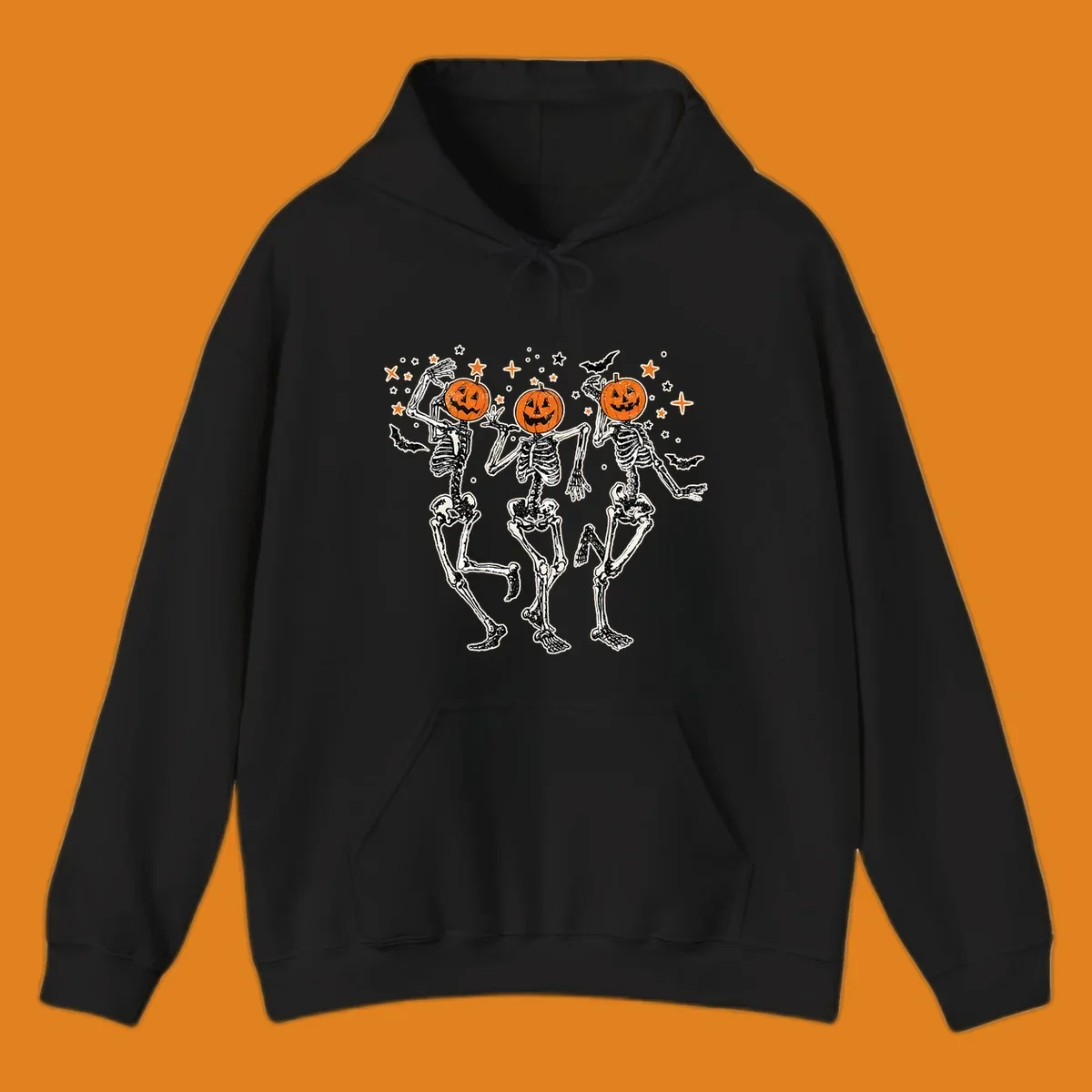 Dancing skeletons with pumpkin heads, bats, and stars illustration for Halloween.