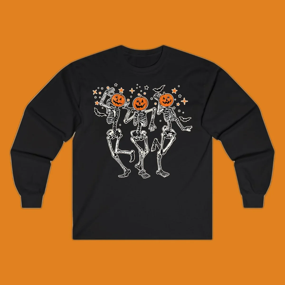 Dancing skeletons with pumpkin heads, bats, and stars illustration for Halloween.