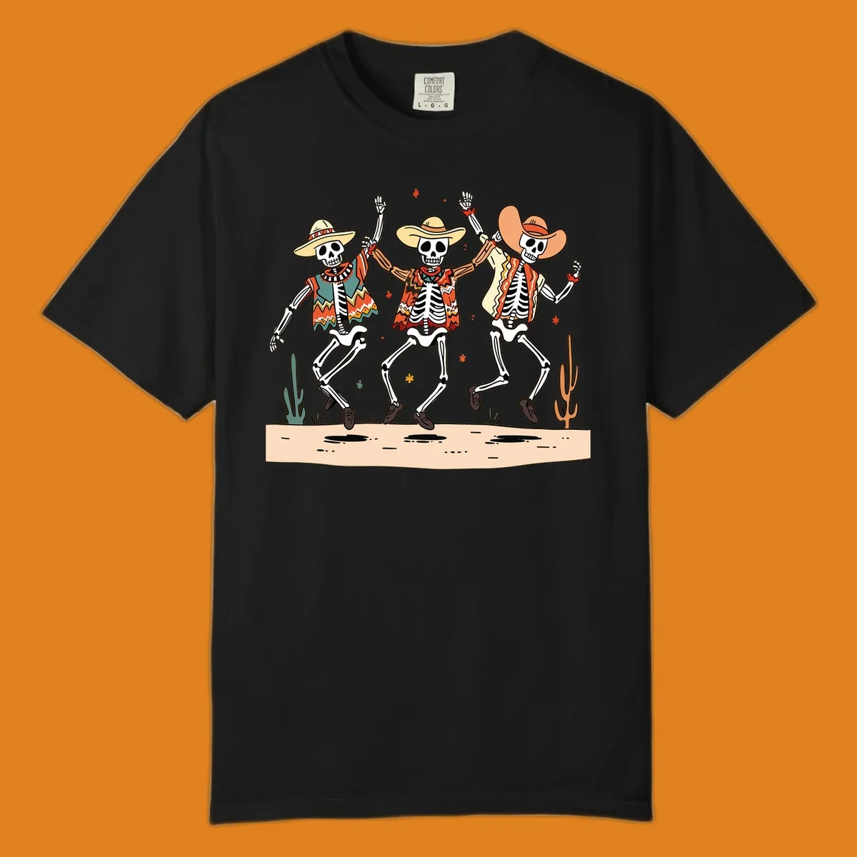 Three dancing skeletons in festive Mexican attire and sombreros, against a dark background with desert elements.