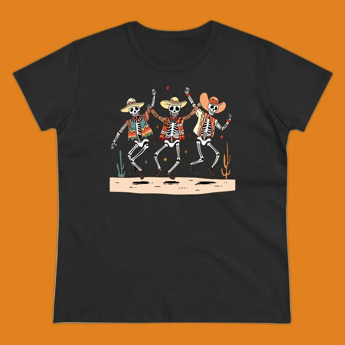 Three dancing skeletons in festive Mexican attire and sombreros, against a dark background with desert elements.