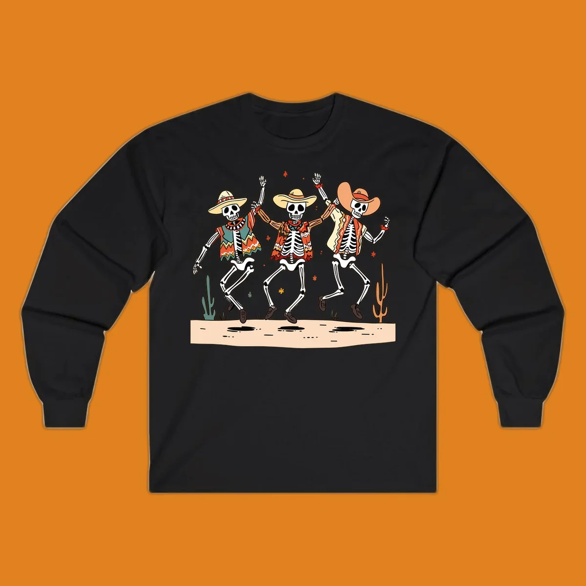 Three dancing skeletons in festive Mexican attire and sombreros, against a dark background with desert elements.