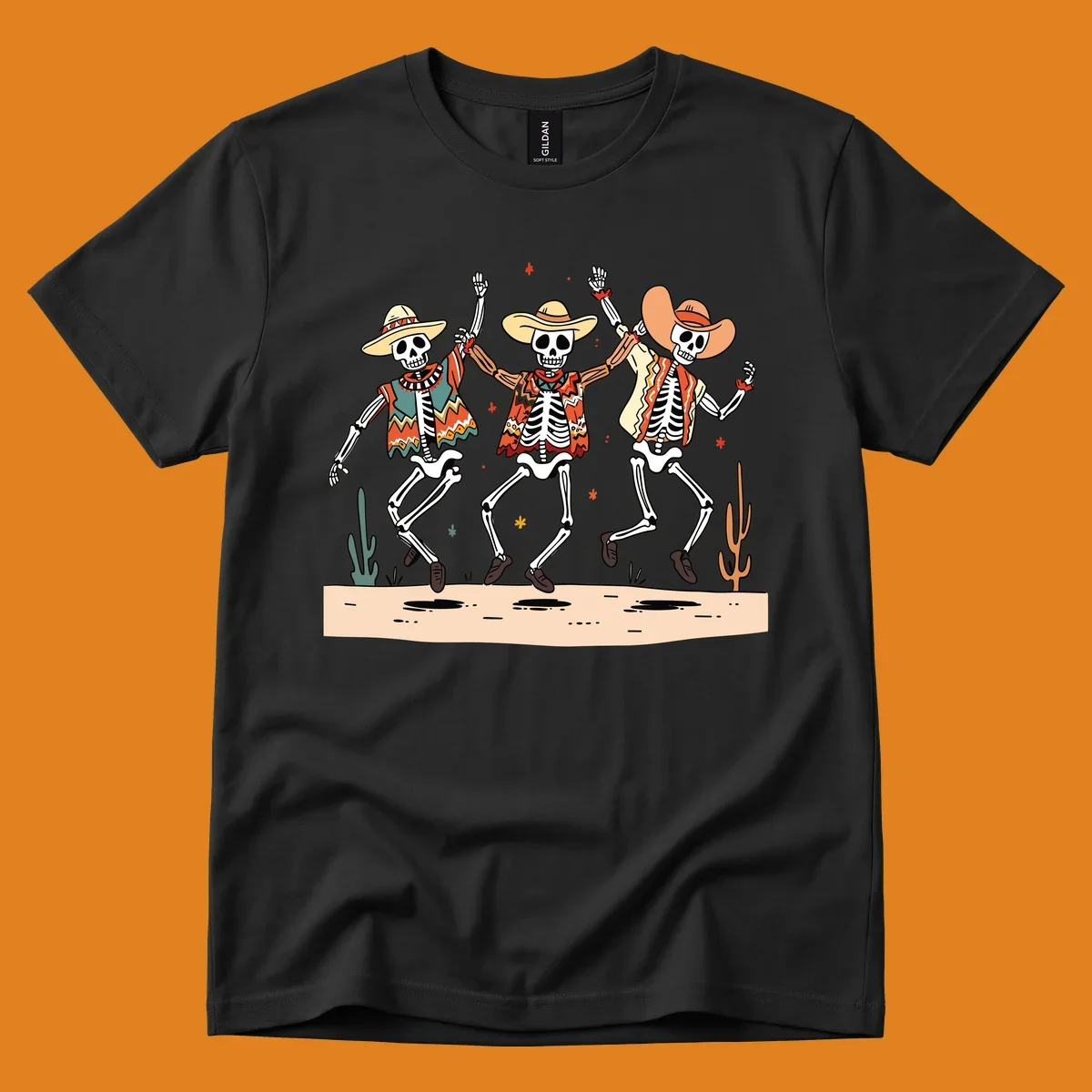 Three dancing skeletons in festive Mexican attire and sombreros, against a dark background with desert elements.