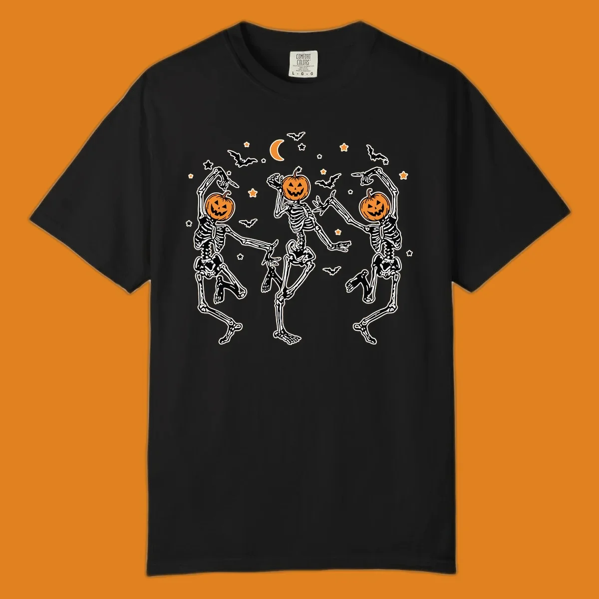 Three dancing skeletons with pumpkin heads, bats, moon, and stars illustration for Halloween.
